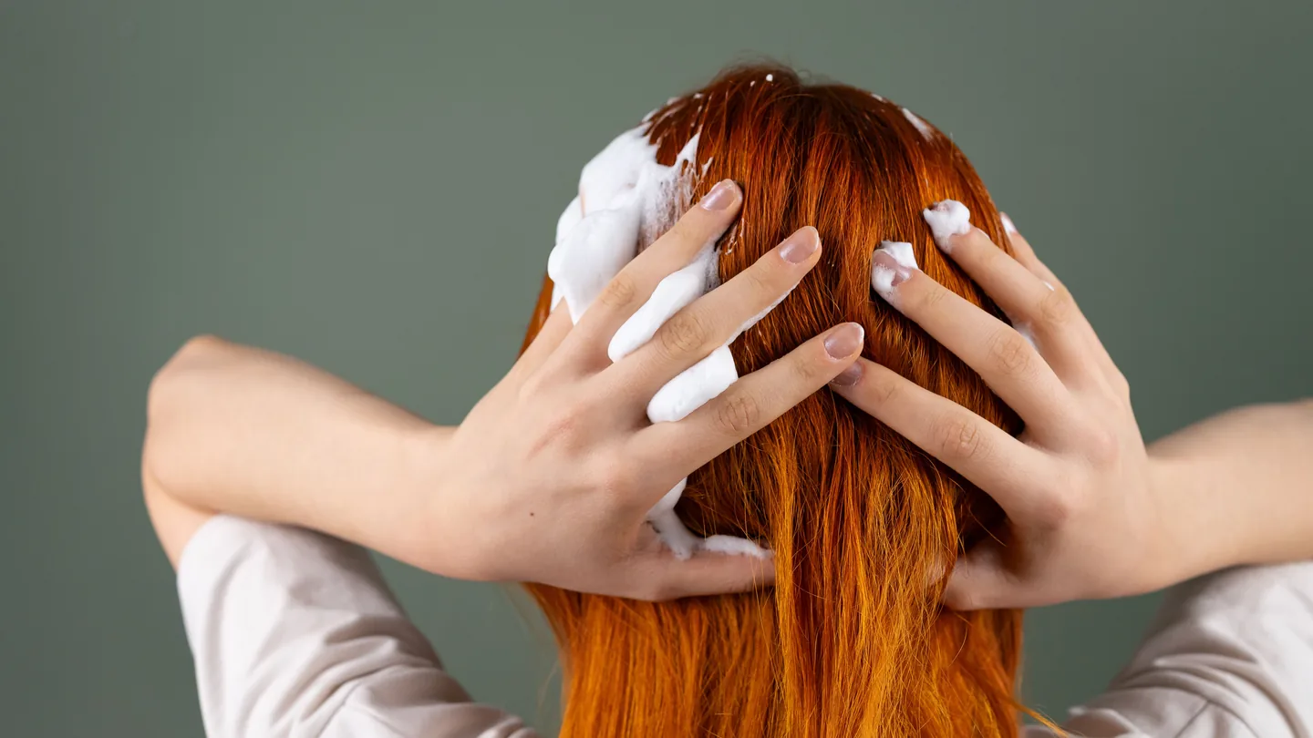 Warm water flowing through hair during a head spa treatment