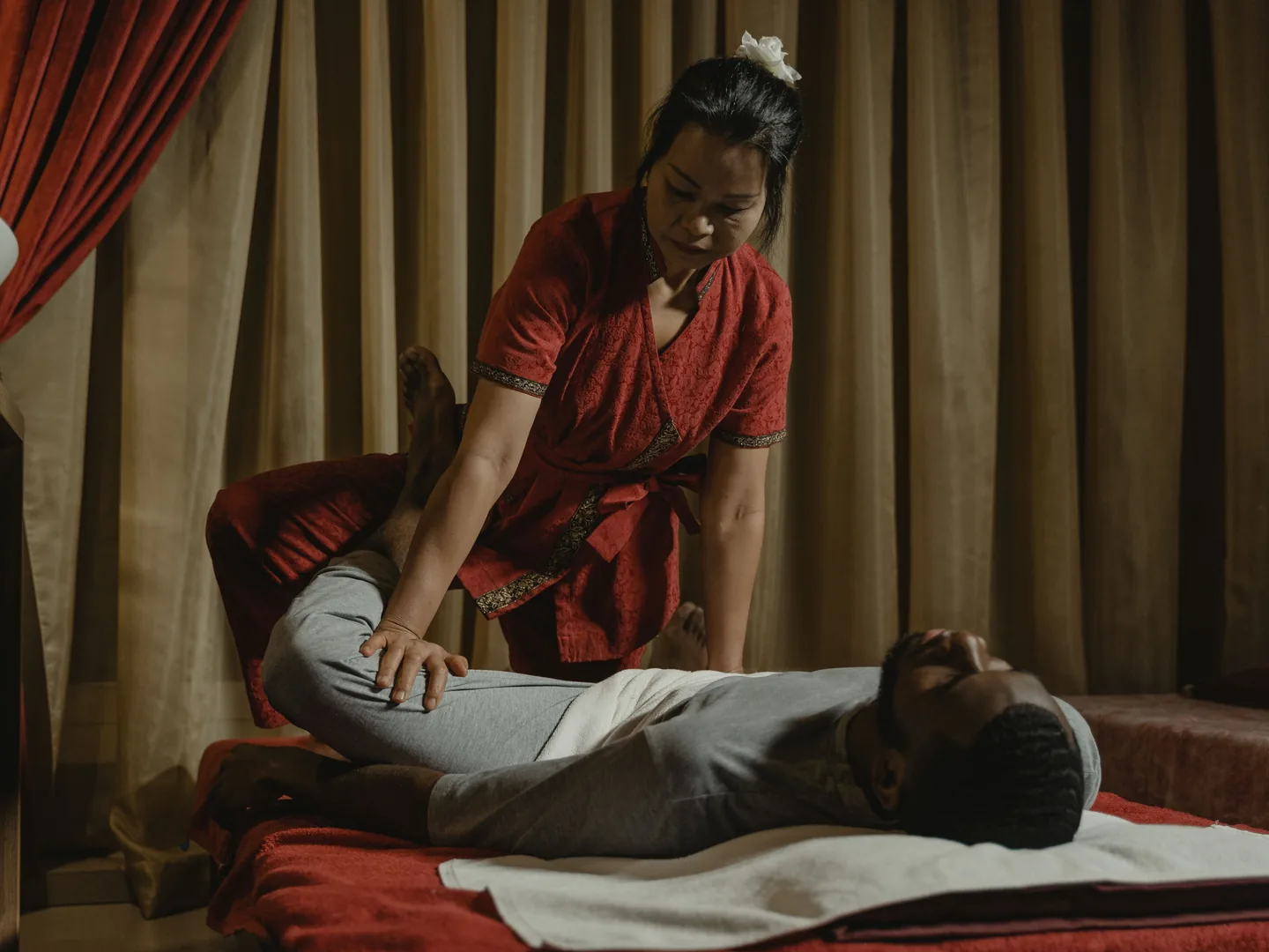 Two massage tables prepared side by side in a couples suite